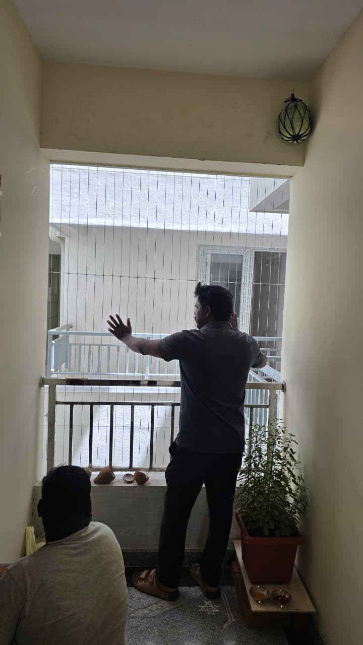 Our team installing a safety net on a balcony